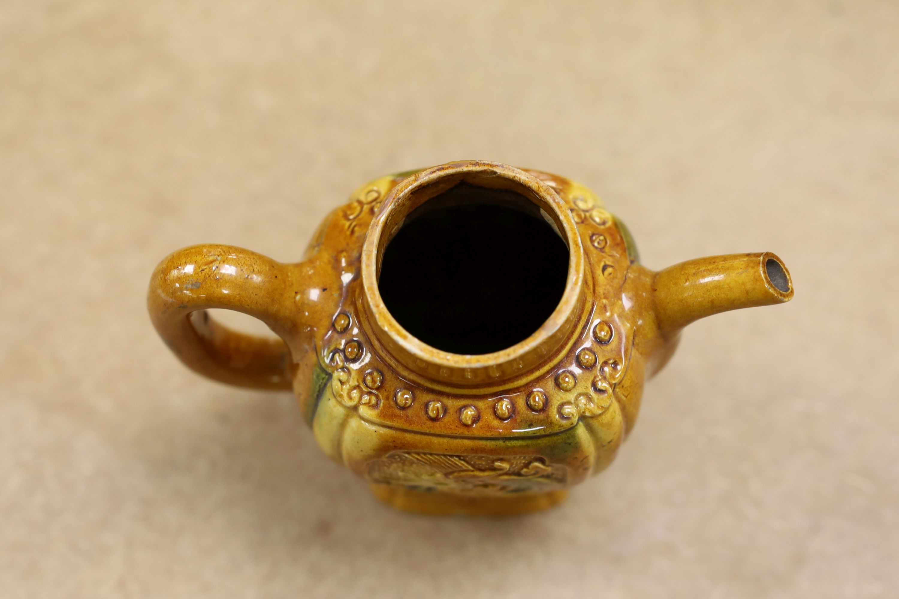 A Chinese enamelled yellow-ground jar and cover, a pottery teapot and cover and a flambe vase, latter 13cm